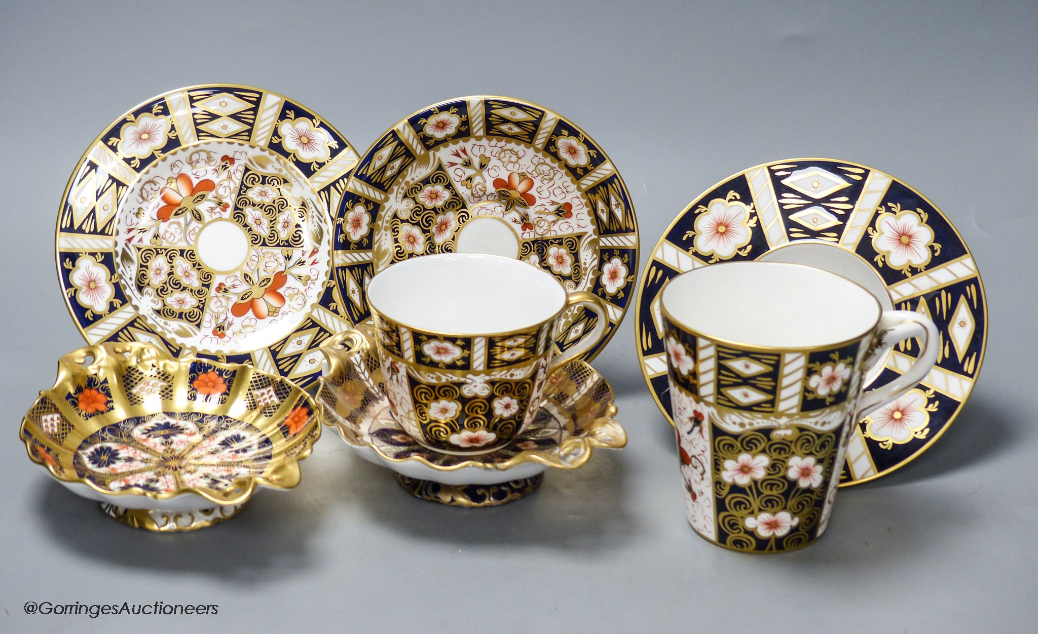 A quantity of Royal Crown Derby cups and saucers